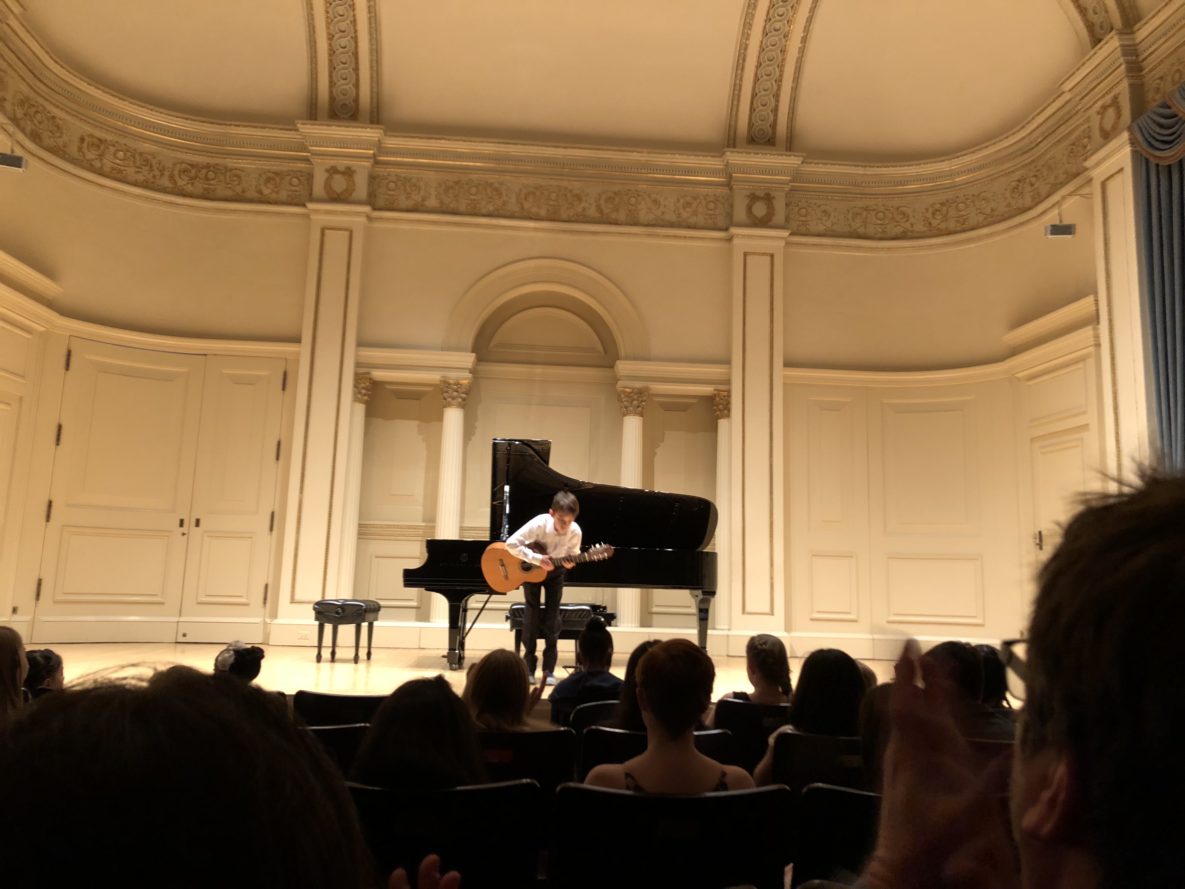 DalMaestro Student Bowing After his Performance at Carnegie Hall